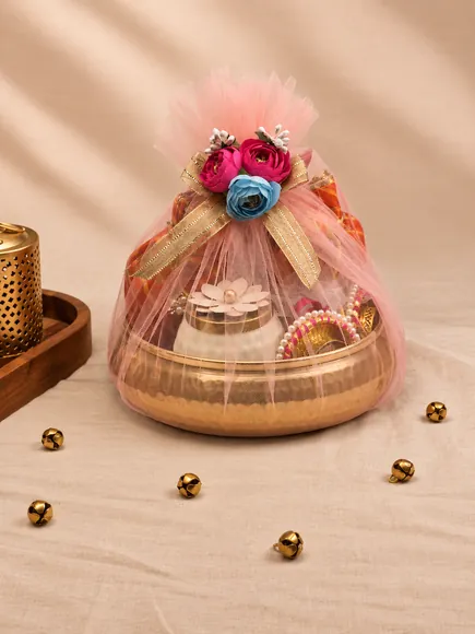 Brass bowl hamper wrapped in pink tulle with pink and blue roses